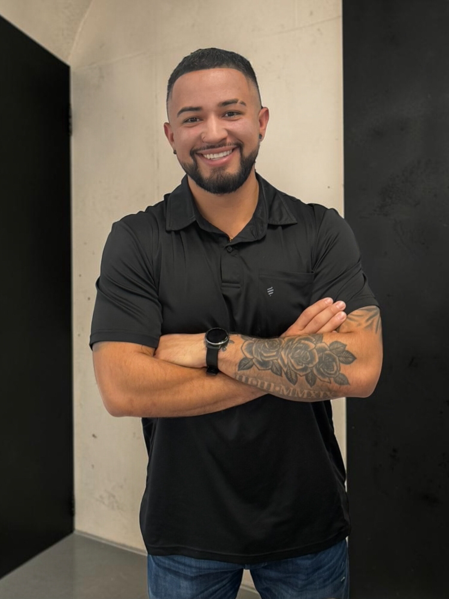 Portrait of Israel, apprentice barber and Army veteran at Taper Godz Barber Co.