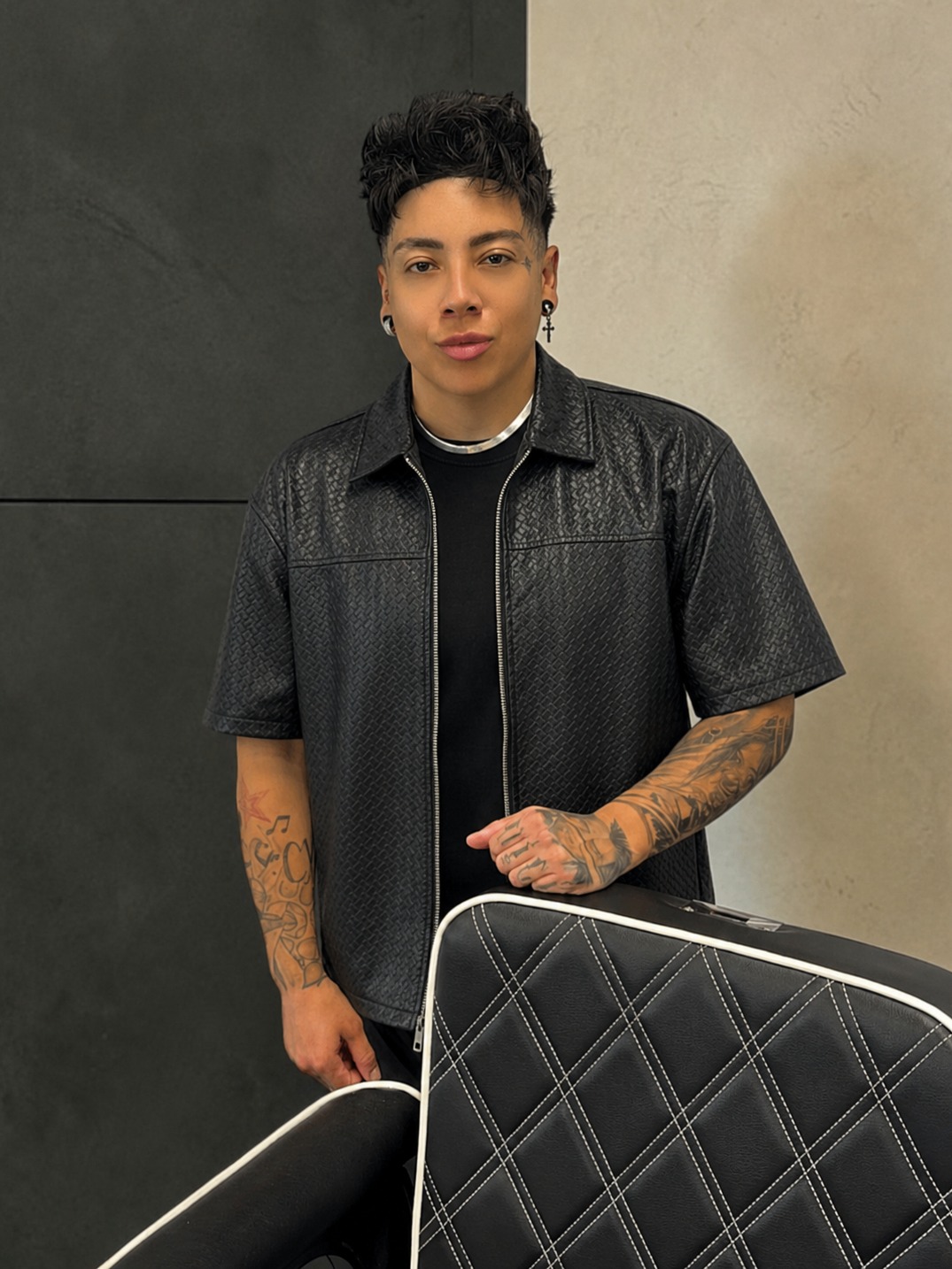 Portrait of Ivana, master barber and owner at Taper Godz Barber Co.